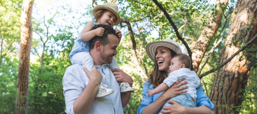 young family hiking in the woods